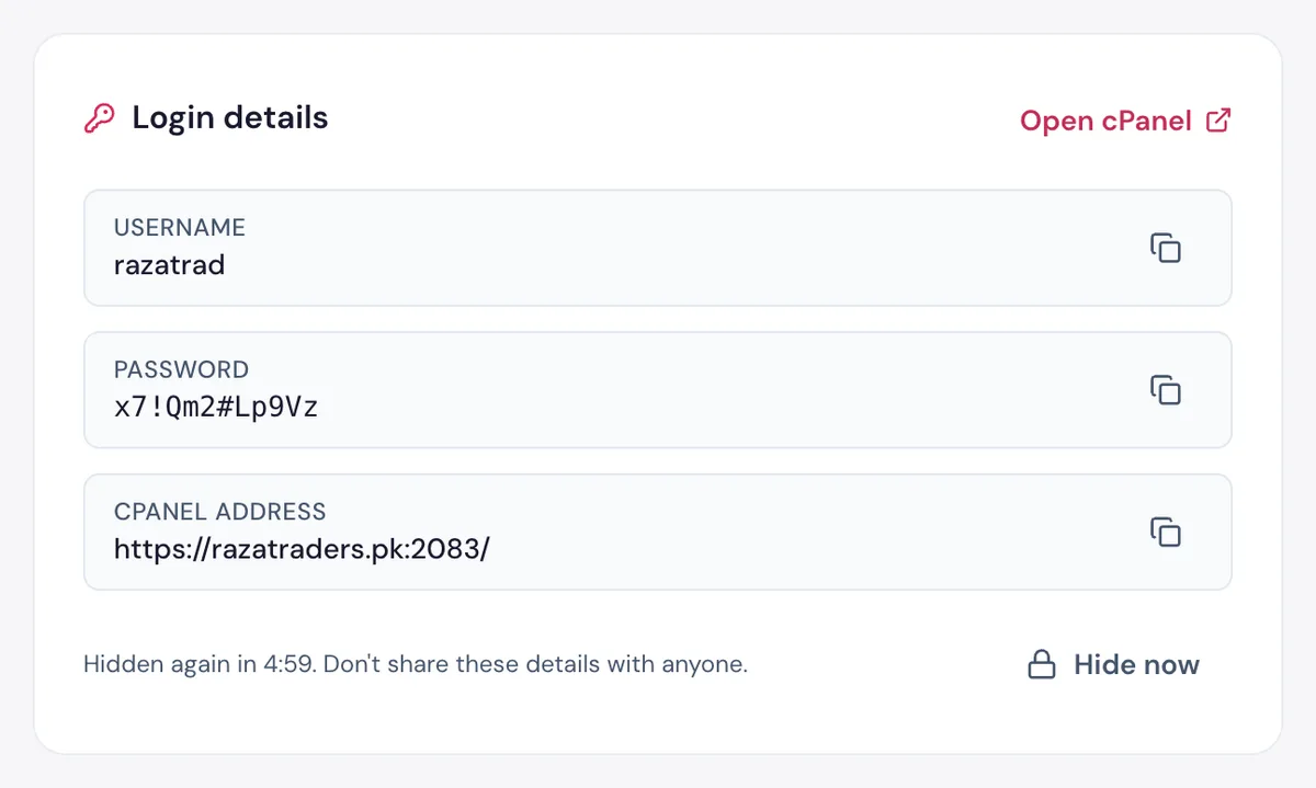The cPanel username, password and address in the HostBring client portal, each with a copy button (example details)